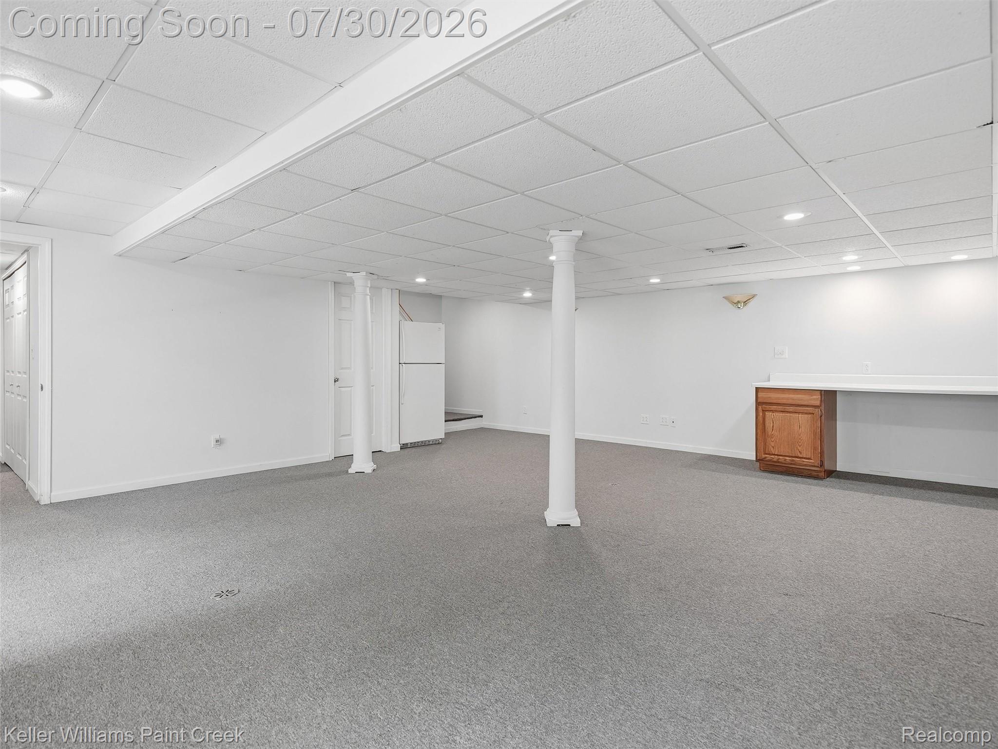 543 Arlington Drive Rochester, MI 48307 - Photo 38 of 59 Expansive lower-level space featuring wall-to-wall carpeting, recessed lighting, and a drop ceiling