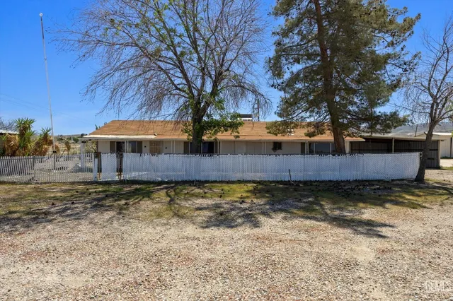 a view of a room with a wooden door