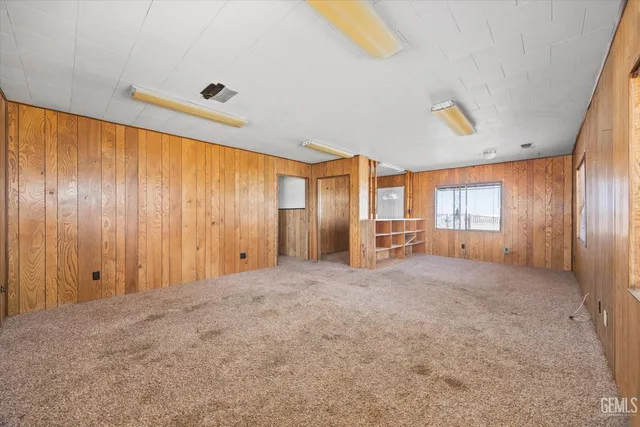 a room with a dresser and a window