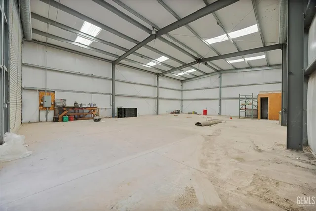 a view of a house with a yard covered in snow