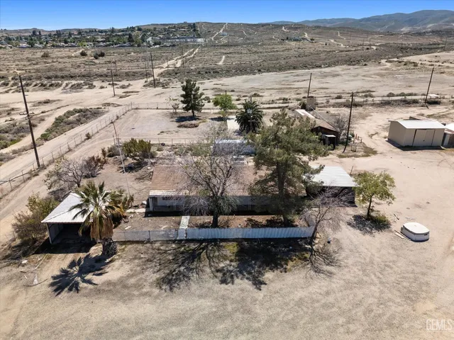 a view of a backyard of the house