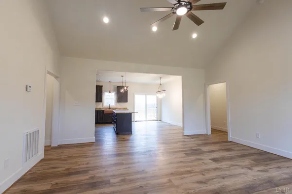 a view of a kitchen with a stove cabinets and wooden floor