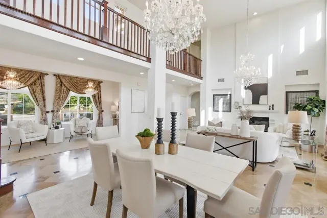 a kitchen with a table chairs stove and cabinets