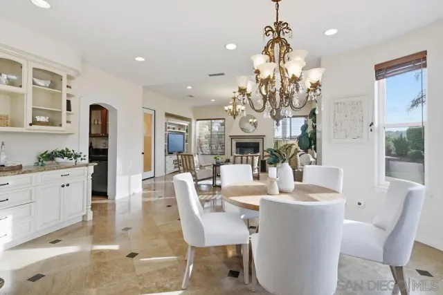 a kitchen with stainless steel appliances granite countertop a sink a stove and cabinets