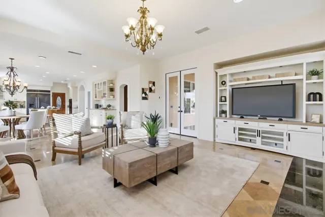 a kitchen with stainless steel appliances granite countertop a sink and a refrigerator