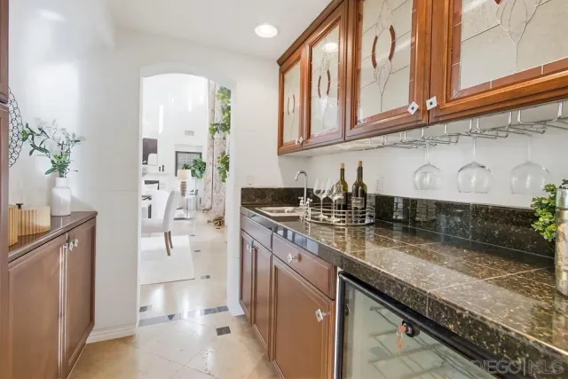 a bathroom with a sink a toilet and shower curtain