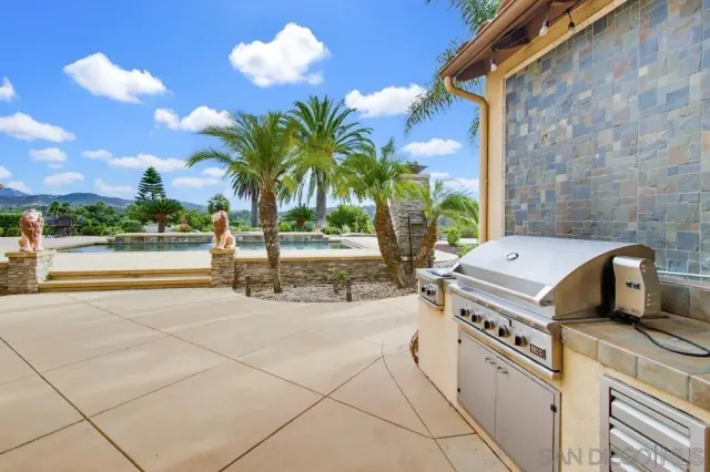 an aerial view of residential house and sandy dunes