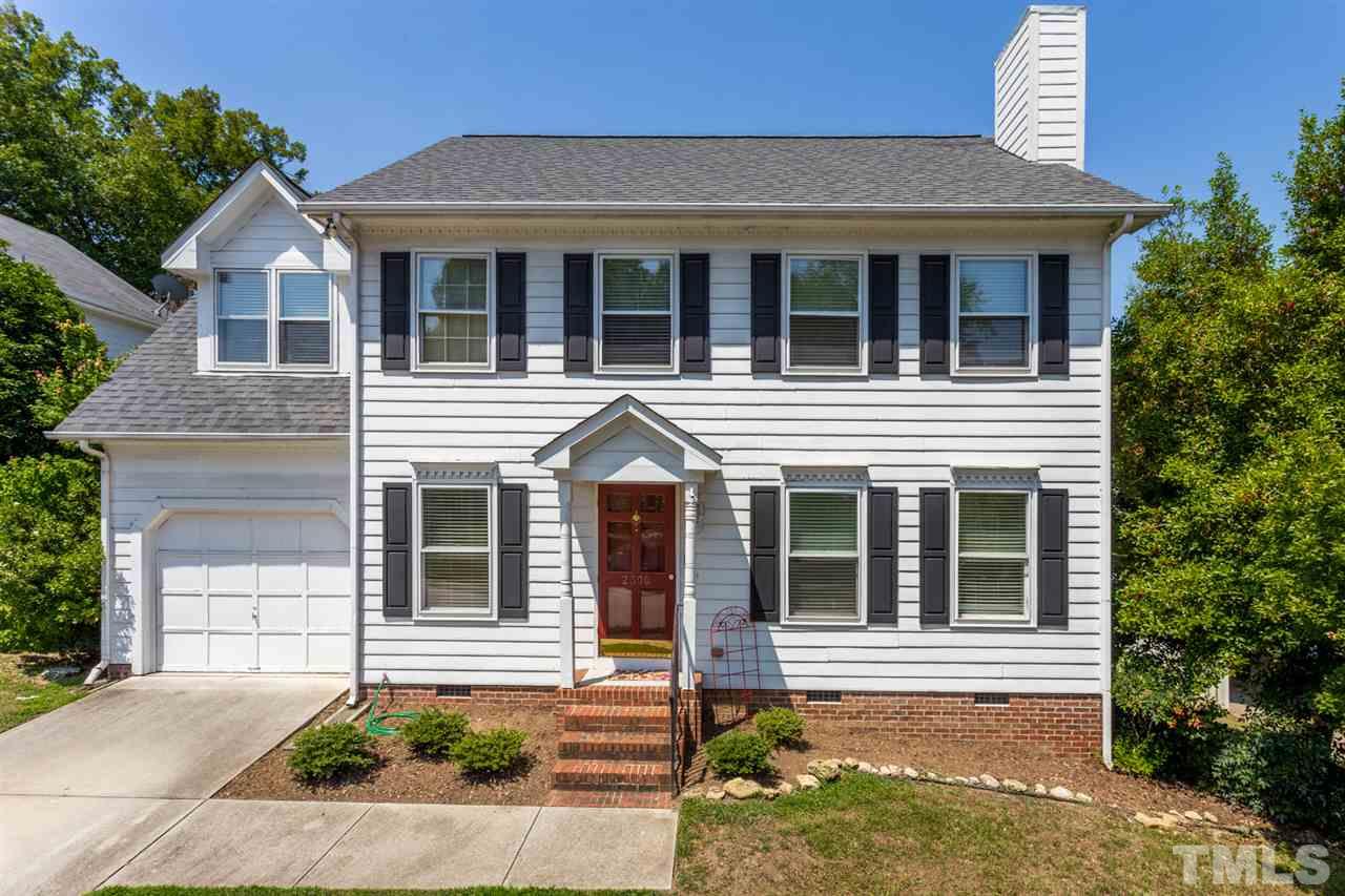 2300 Declaration Drive Raleigh, NC 27615 - Photo 1 of 30 a view of a white house with large windows and a yard