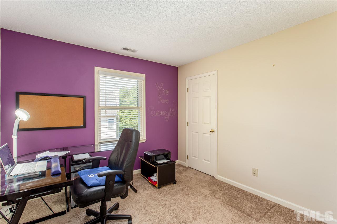 2300 Declaration Drive Raleigh, NC 27615 - Photo 19 of 30 a living room with furniture and a window
