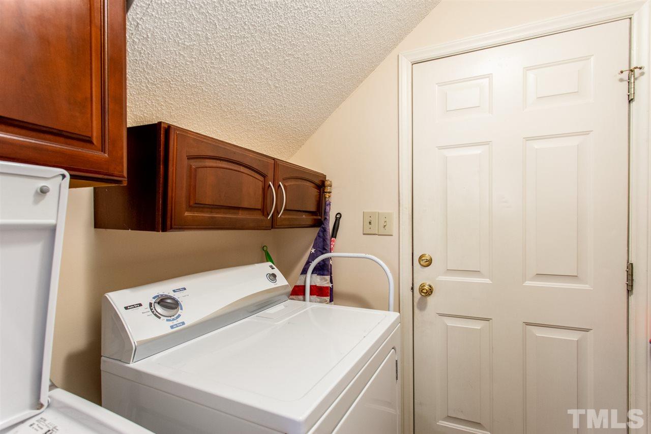 2300 Declaration Drive Raleigh, NC 27615 - Photo 24 of 30 a utility room with dryer and washer
