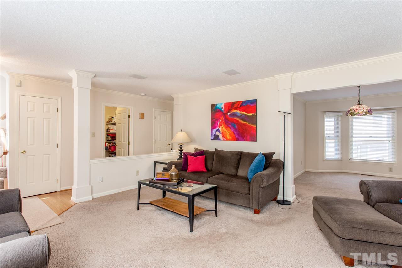 2300 Declaration Drive Raleigh, NC 27615 - Photo 4 of 30 a living room with furniture and a flat screen tv