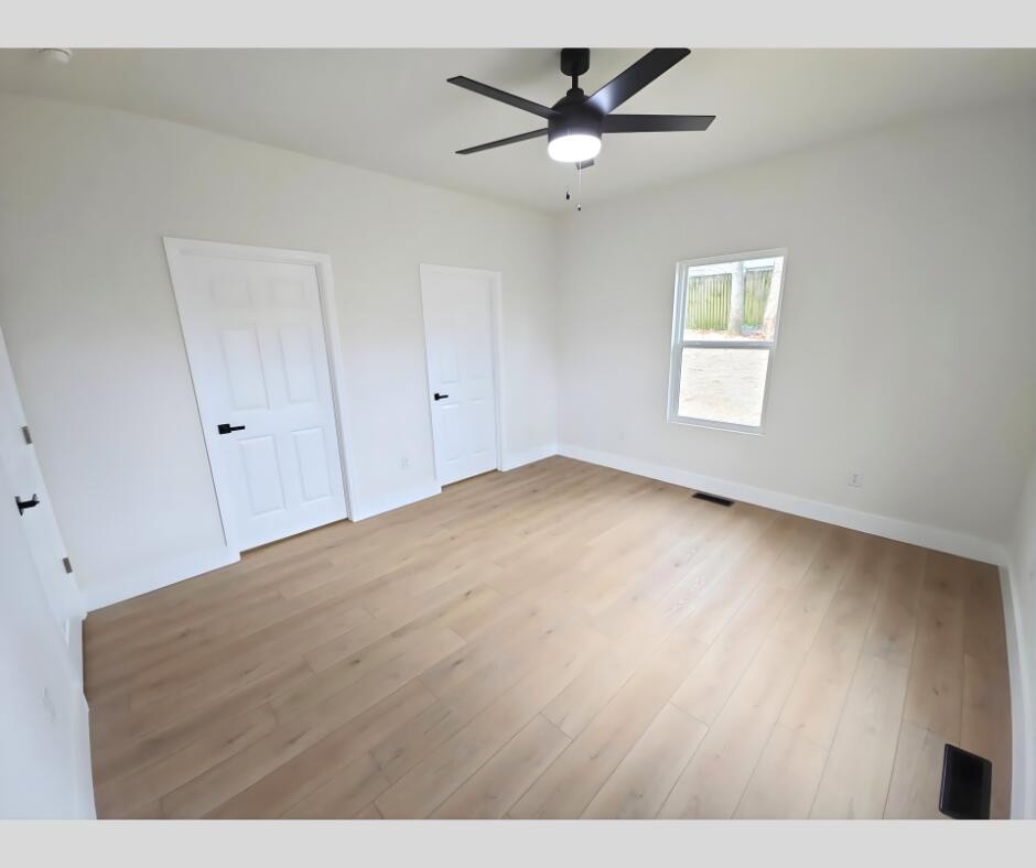 432 Englewood Road Madisonville, TN 37354 - Photo 9 of 13 a view of a big room with wooden floor and windows