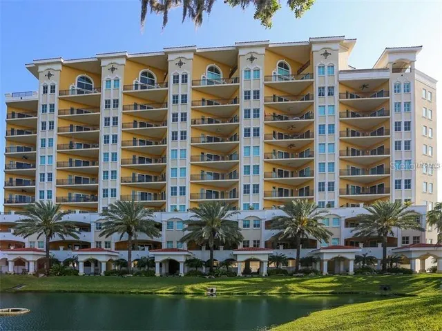 a front view of a building with a garden