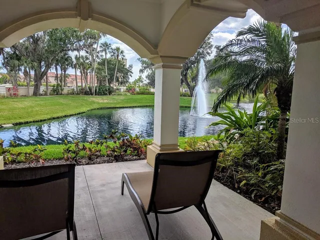 a view of a chair and table in a garden