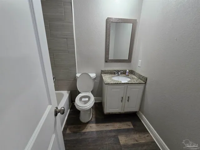 a bathroom with a toilet and a sink