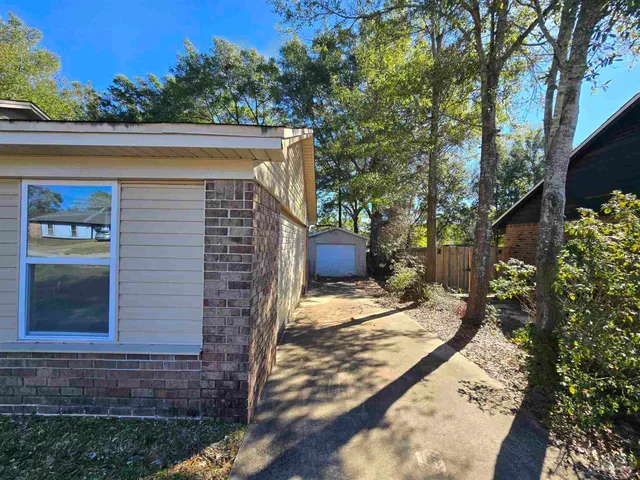 a view of a house with a small yard