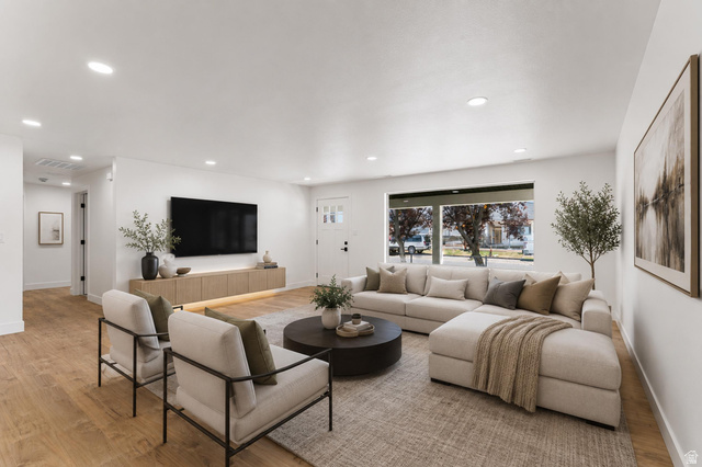 1898 West 600 South Provo, UT 84601 - Photo 12 of 32 Spacious living area featuring light wood-finish flooring, recessed lighting, and a broad window