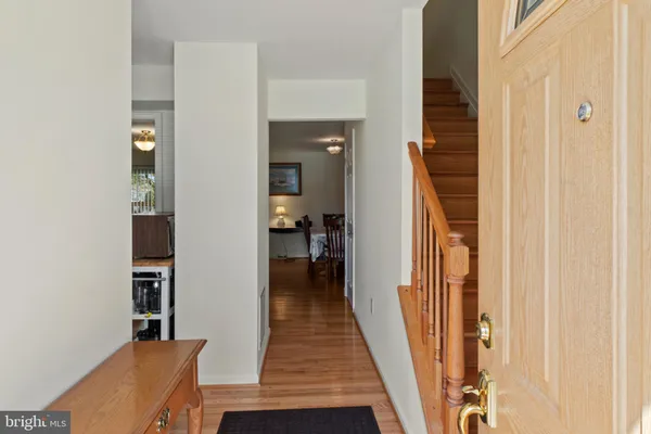 a view of a swimming pool with a patio and trees