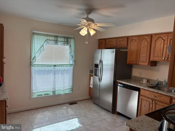 a view of a backyard with sitting area