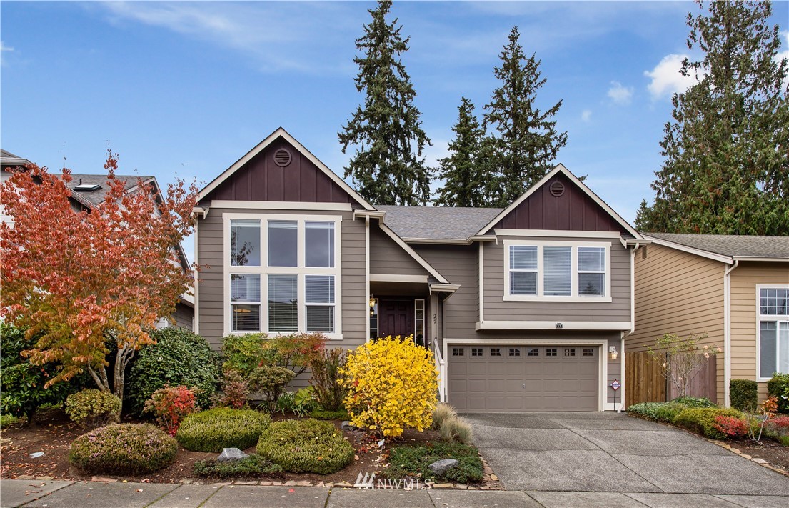 27 167th Place Southwest Bothell, WA 98012 - Photo 1 of 25 a front view of a house with a yard and garage