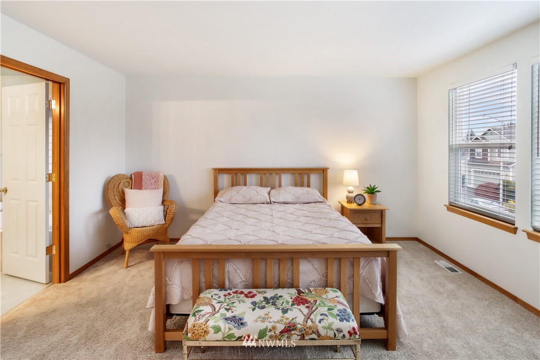 27 167th Place Southwest Bothell, WA 98012 - Photo 14 of 25 a bedroom with a bed and window