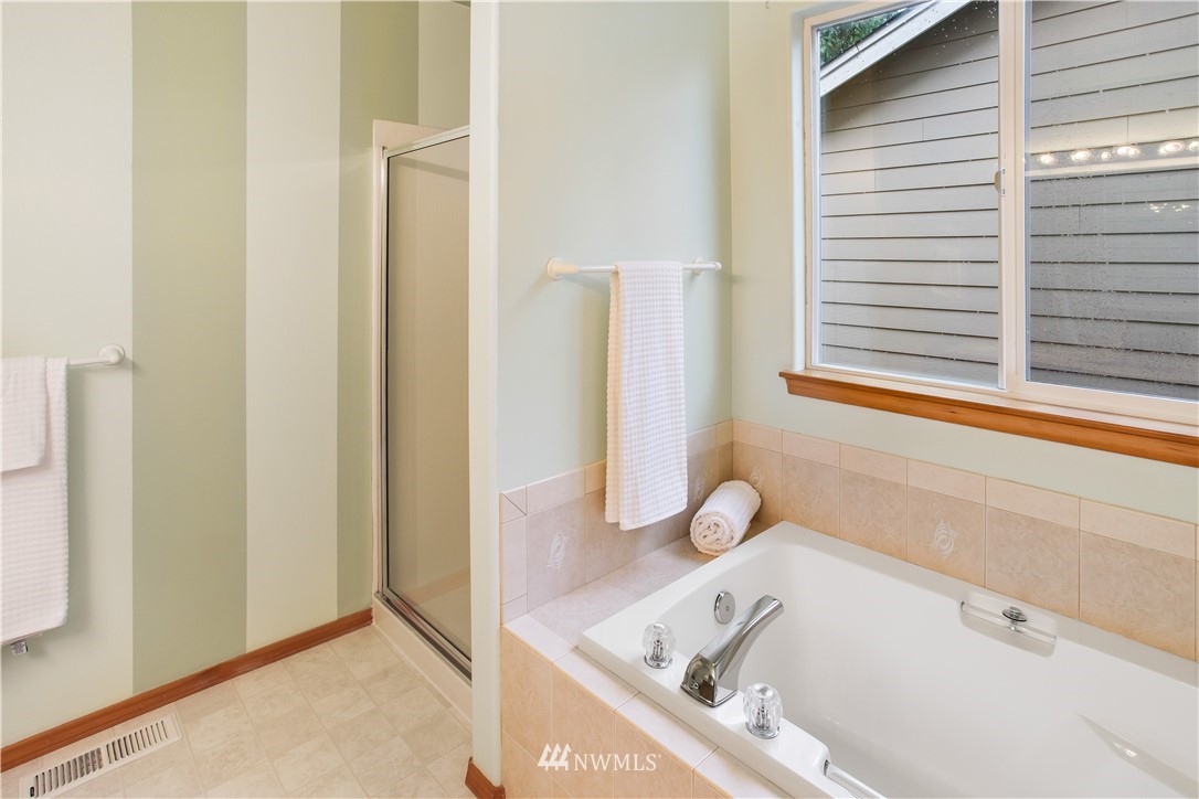 27 167th Place Southwest Bothell, WA 98012 - Photo 16 of 25 a bathroom with a bathtub and a window