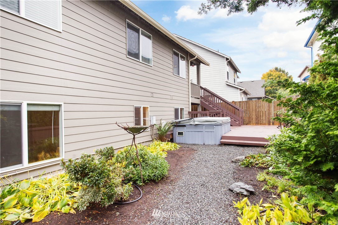 27 167th Place Southwest Bothell, WA 98012 - Photo 23 of 25 a view of a house with backyard and sitting area