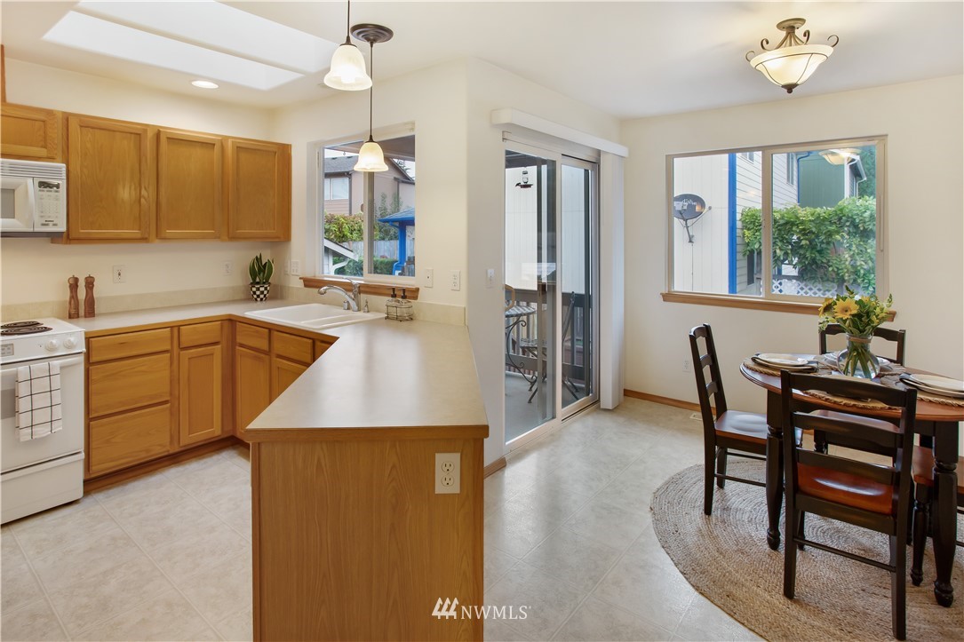 27 167th Place Southwest Bothell, WA 98012 - Photo 5 of 25 a kitchen with a table chairs sink and cabinets