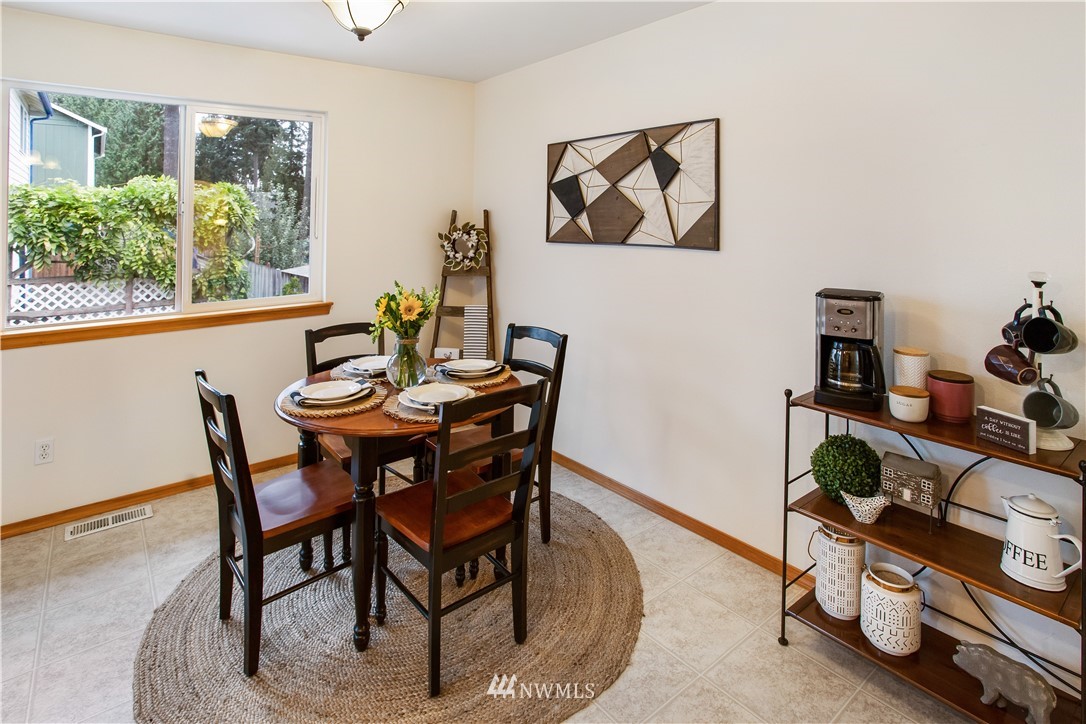 27 167th Place Southwest Bothell, WA 98012 - Photo 8 of 25 a view of a dining room with furniture window and outside view