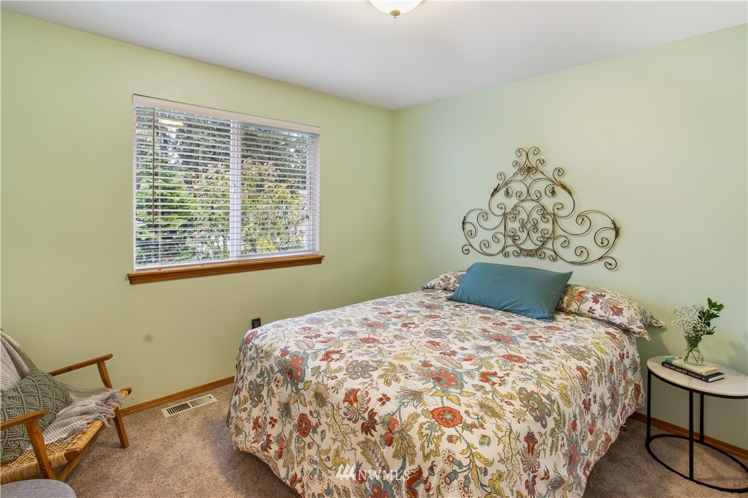 27 167th Place Southwest Bothell, WA 98012 - Photo 10 of 25 a bedroom with a bed and a table