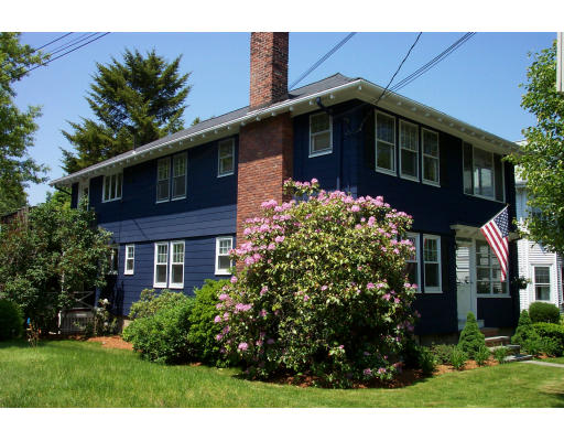 67-69 Withington Road, Unit 67 Newton, MA 02460 - Photo 1 of 1 a front view of a house with a yard
