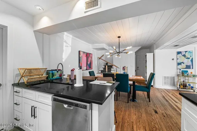 a bathroom with a sink and mirror