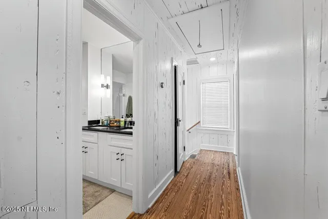 a bathroom with a double vanity sink toilet and shower
