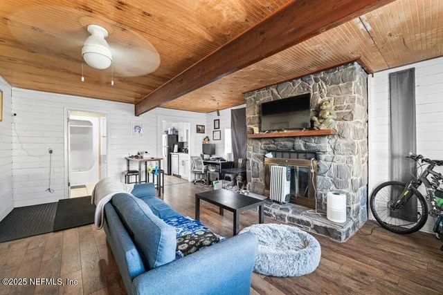 a kitchen with a refrigerator a sink a stove and cabinets