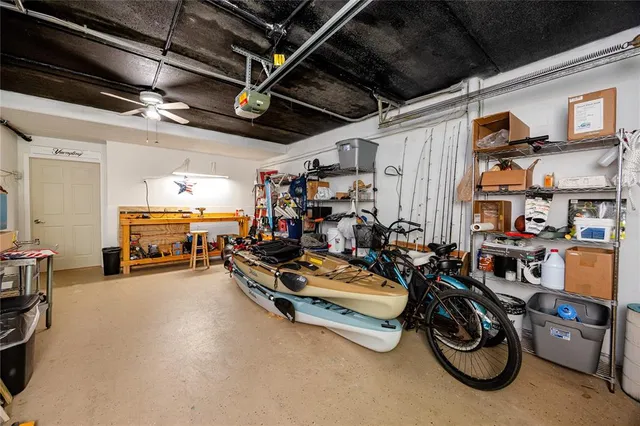 a living room with furniture and a ceiling fan
