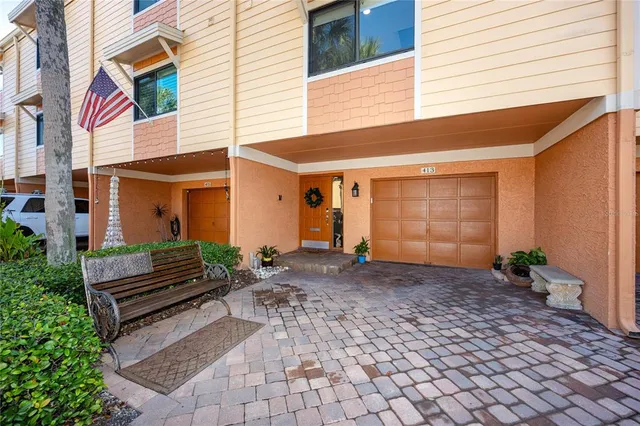 a view of a house with wooden fence