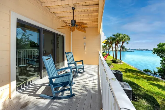 a view of a ocean with lounge chair