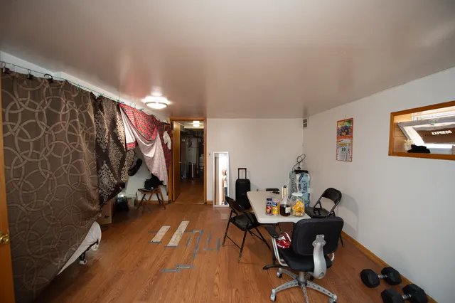 a view of a workspace with furniture and a workspace