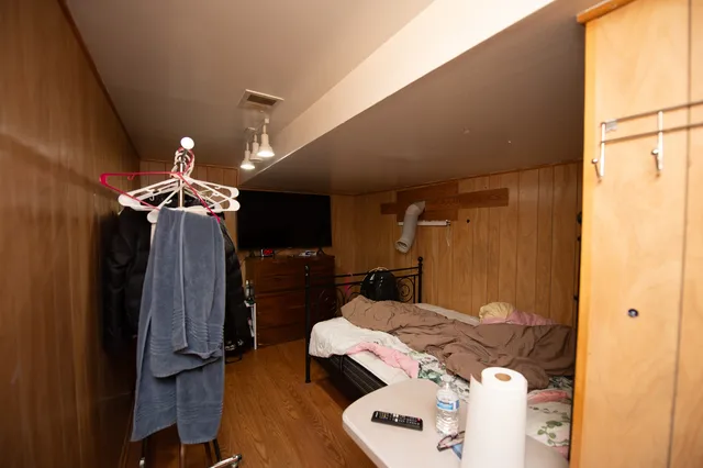 a bedroom with bed and a window