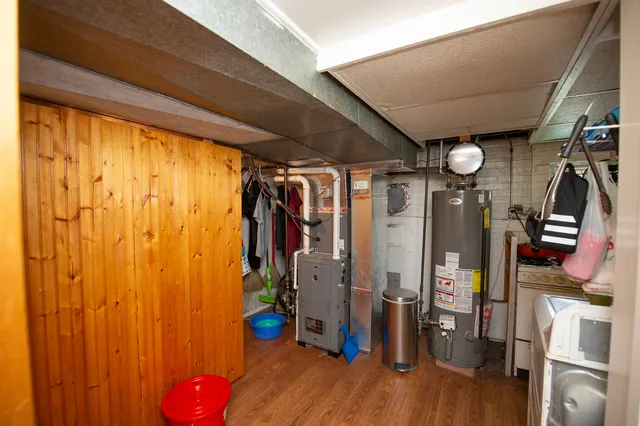 a view of a room with wooden floor and windows