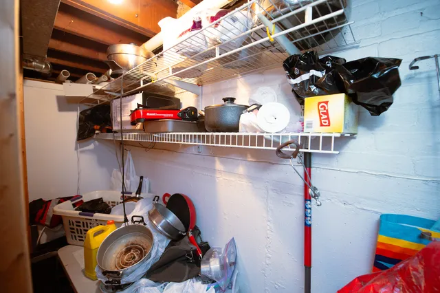 a view of storage and utility room with racks on the wall