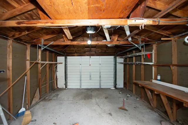 a view of a room with wooden walls