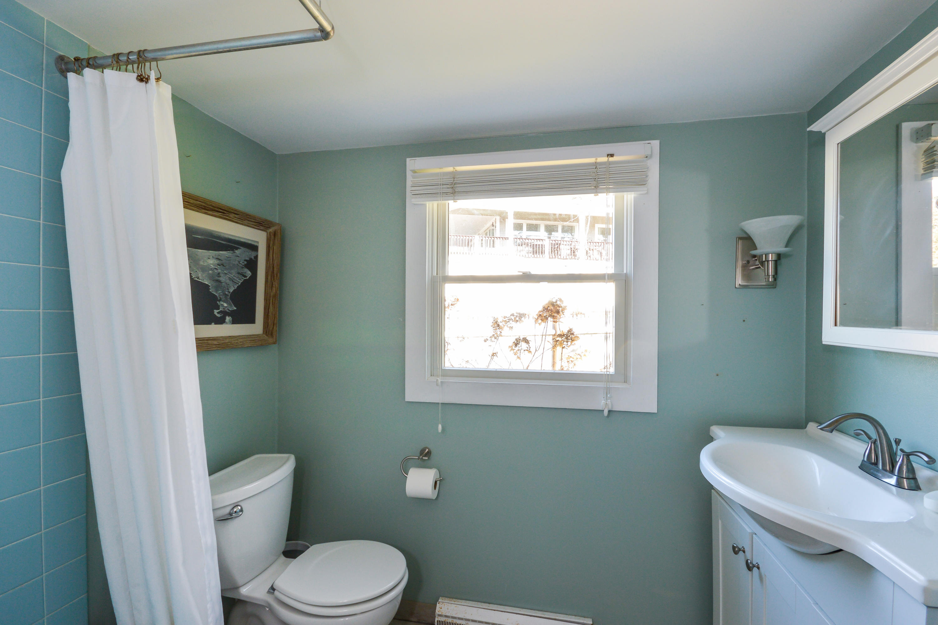 171 Bay Road North Falmouth, MA 02556 - Photo 16 of 24 a bathroom with a sink toilet and a mirror