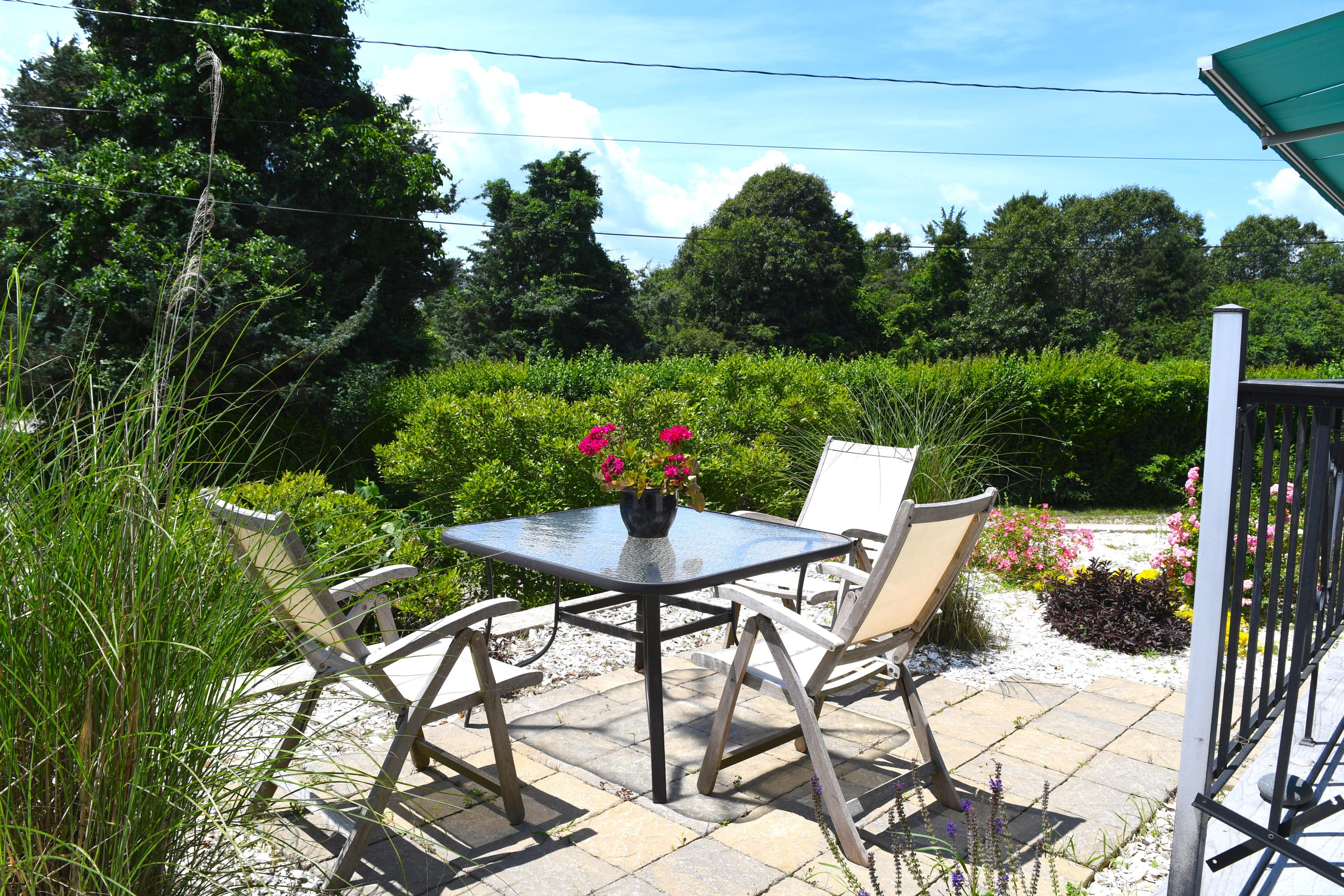 171 Bay Road North Falmouth, MA 02556 - Photo 18 of 24 a view of a chairs and table in the patio