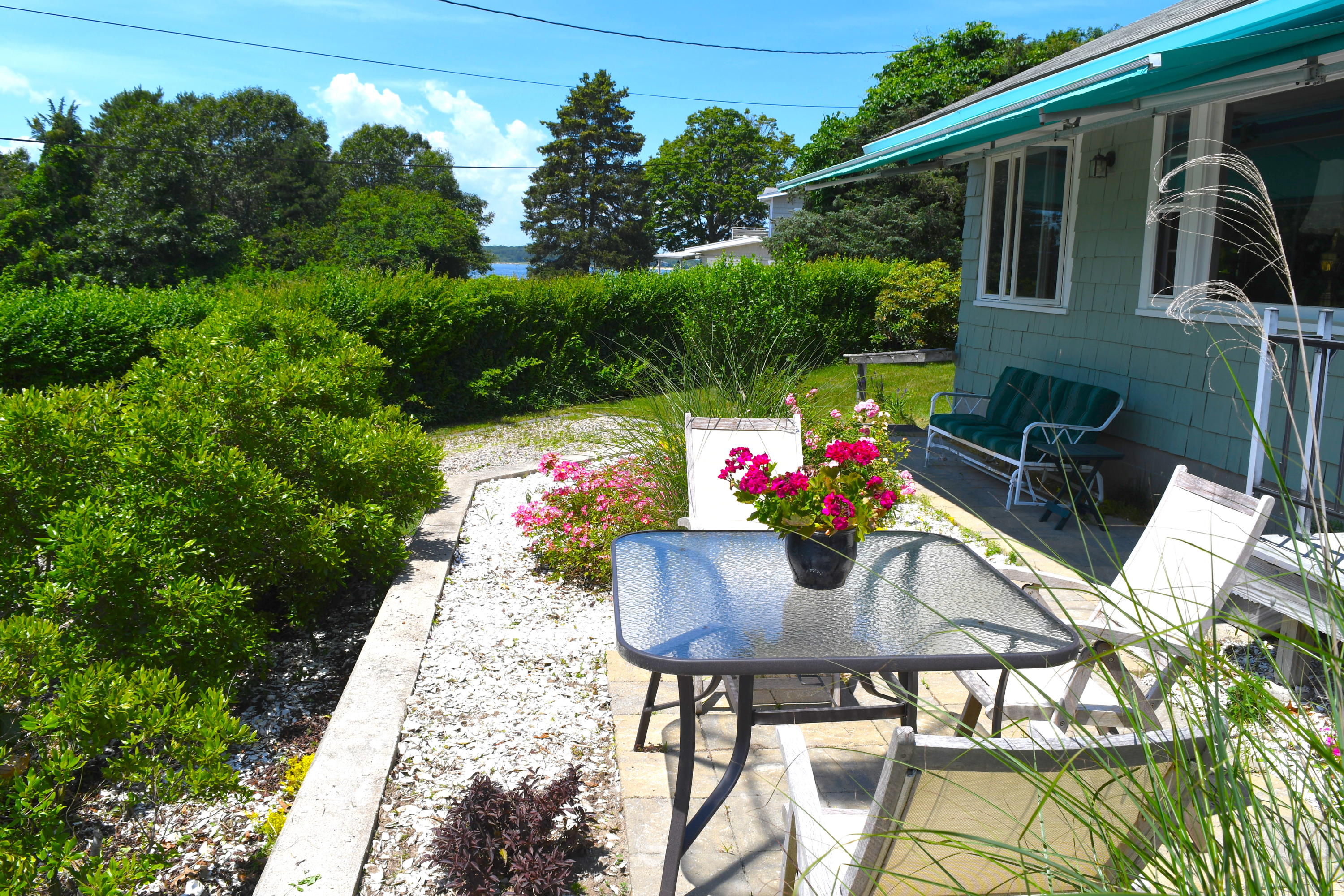 171 Bay Road North Falmouth, MA 02556 - Photo 24 of 24 a view of an chairs and table in the patio