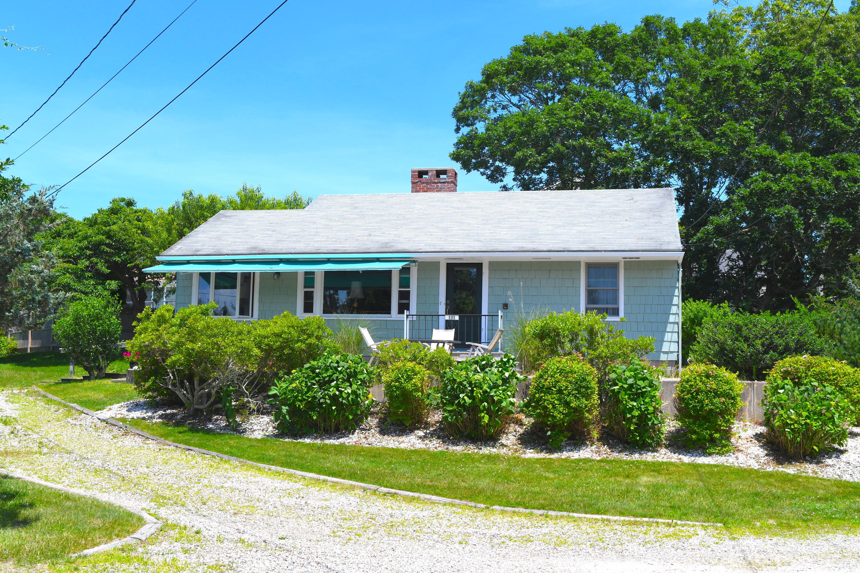 171 Bay Road North Falmouth, MA 02556 - Photo 3 of 24 a front view of a house with a yard