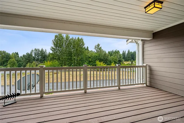 a view of deck with wooden floor and outdoor seating