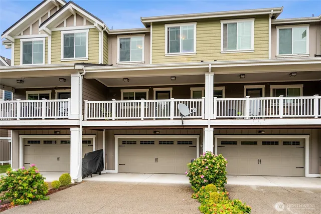a front view of a house with a garage