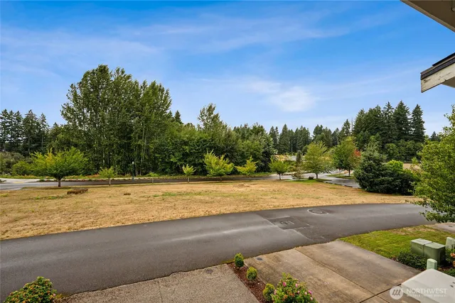 a view of a swimming pool with an outdoor space and seating area