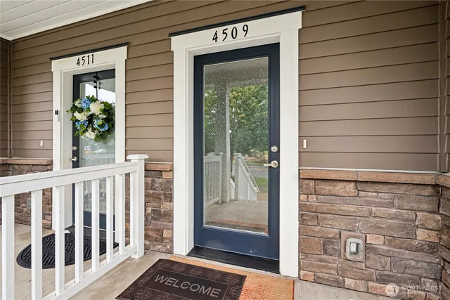 a view of a door and a window